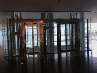 Passenger lifts or elevators in circular shaped covered by Toughened glass partition for consumers...