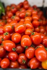 A bunch of fresh red small tomatoes