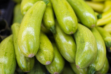 A bunch of fresh zucchini at the grocery store