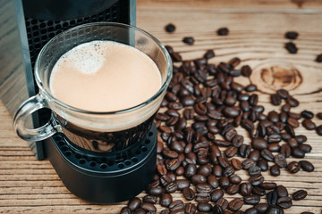 Espresso coffee maker on a wooden table.