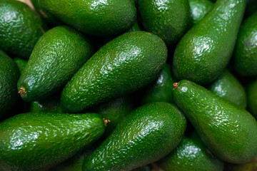 A bunch of ripe avocados at the grocery store
