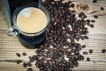 Espresso coffee maker on a wooden table.