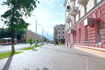 Naklejka premium Street of Belarusian city of Gomel. Urban bustle. Quite city life