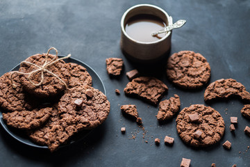 traditional freshly baked chocolate cookies on a black background close-up. quick snack
