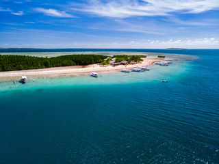 Fototapeta na wymiar Aerial view of tropical island surrounded by turquoise water