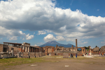 Fototapeta na wymiar Ruins of Roman forum with Capitolium in the ancient town of Pompeii, Italy