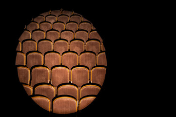 The hall is illuminated by a searchlight. The beam on the left side of the concert hall is dark at the edges. There is a place for text.