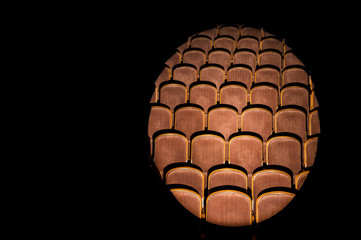 The hall is illuminated by a searchlight. The beam on the right side of the concert hall is dark at the edges There is a place for text.