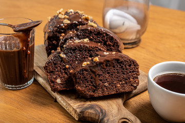 sliced brownie covered with chocolate ganache with coffee