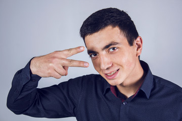man shows peace sign