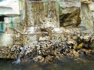 Fototapeta na wymiar Fountain fragment close up