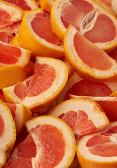 Grapefruit web banner background. Pile of fresh cut grapefruits. Fruits summer bright concept