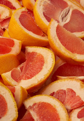 Grapefruit web banner background. Pile of fresh cut grapefruits. Fruits summer bright concept