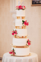 white wedding cake with roses