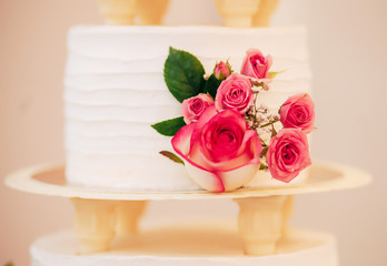 white wedding cake with roses