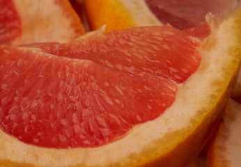 Grapefruit web banner background. Pile of fresh cut grapefruits. Fruits summer bright concept