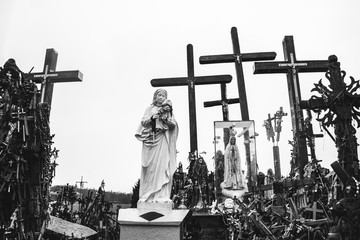 The statue of Virgin Mary holding baby Jesus on the Hill of Crosses