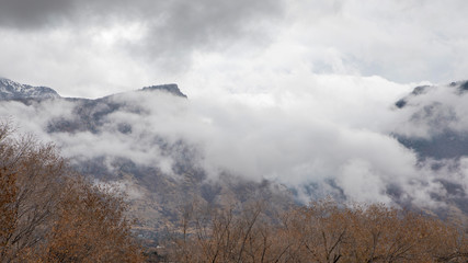 Fototapeta premium Clouds over mountain range after rainstorm in Utah.