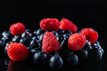 A scattering of berries. Pure berries, spraying water. Wet berries, drops on the berries. Dew