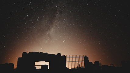 Night photography of the ruins of epecuen, the stars light up the sky near the carhue town,...