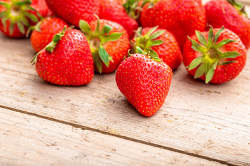 Strawberries on a wooden surface background