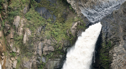 Close up of the crest of a large waterfall in Baños, Ecuador.