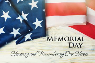 American flag and a poppy flowers with Memorial Day Remember and Honor text background	