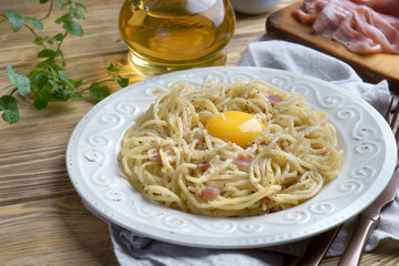 spaghetti Carbonara on a wooden background
