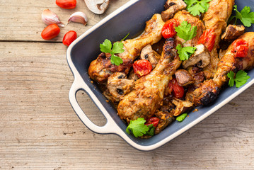 Baked chicken legs with vegetables