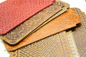 Patterned leather for smartphone cases on work table