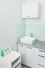 white clean sink in the medical center cabinet