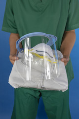 Medical staff offering personal protective equipment.