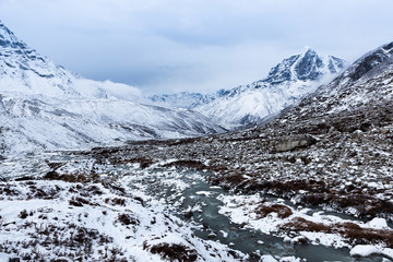 Chukhung valley on Everest Base Camp trek at snowy day. Himalayan mountains in snow. Nepal.