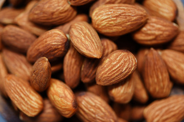 Almonds top view - Close up of roasted almond nuts background