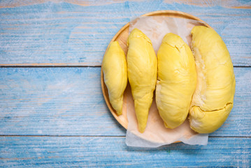 Durian fruit fresh from tree peel on wooden plate - Ripe durian tropical fruit summer for sweet dessert or snack in Thailand