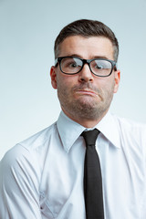 Businessman with funny discouraged face