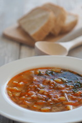 Vegetable soup with potatoes, carrots, barley and pickle cucumbers.