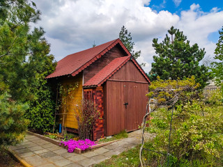 Fototapeta na wymiar tiny wooden house in the garden