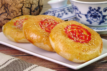 A sweetheart cake (Lao Po Bing) or wife cake or marriage pie is a traditional Cantonese pastry with a thin crust of flaky pastry. (Red Chinese word “Fu” on cake mean “Happiness”)