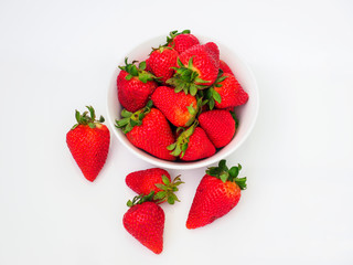 bowl of fresh strawberries on white background
