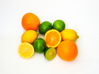 sliced limes lemons and oranges on white background