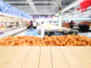 wooden table or wooden mock up over blurred supermarket background