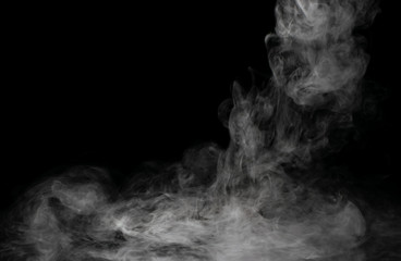 White puffs of smoke on a black background float mixing in bizarre chaotic patterns of thin threads