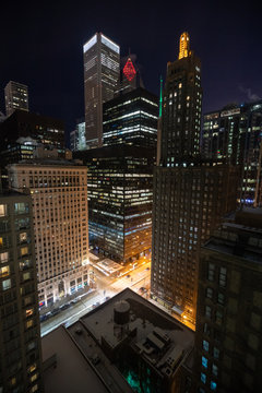Image of Dense City Metropolis at Night with busy streets and tall skyscrapers in Chicago, USA