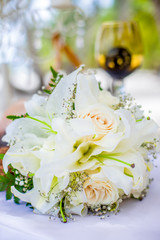 Bridal flowers bouquet on the sandy beach as decoration for tropical destination wedding ceremony