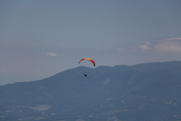 paraglider in the blue sky