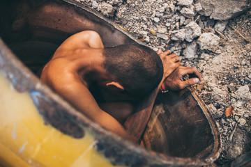 poor people,homeless or beggar begging for help sitting at dirty slum.concept for poverty...