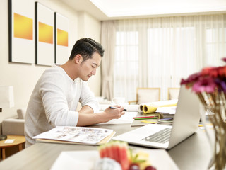 young asian man designer working from home