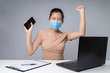 Fototapeta na wymiar Asia woman working from home during coronavirus outbreak