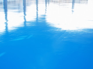 Blue cement flooring with reflection during the day time Newly built stadium, Futsal field. Selective focus 